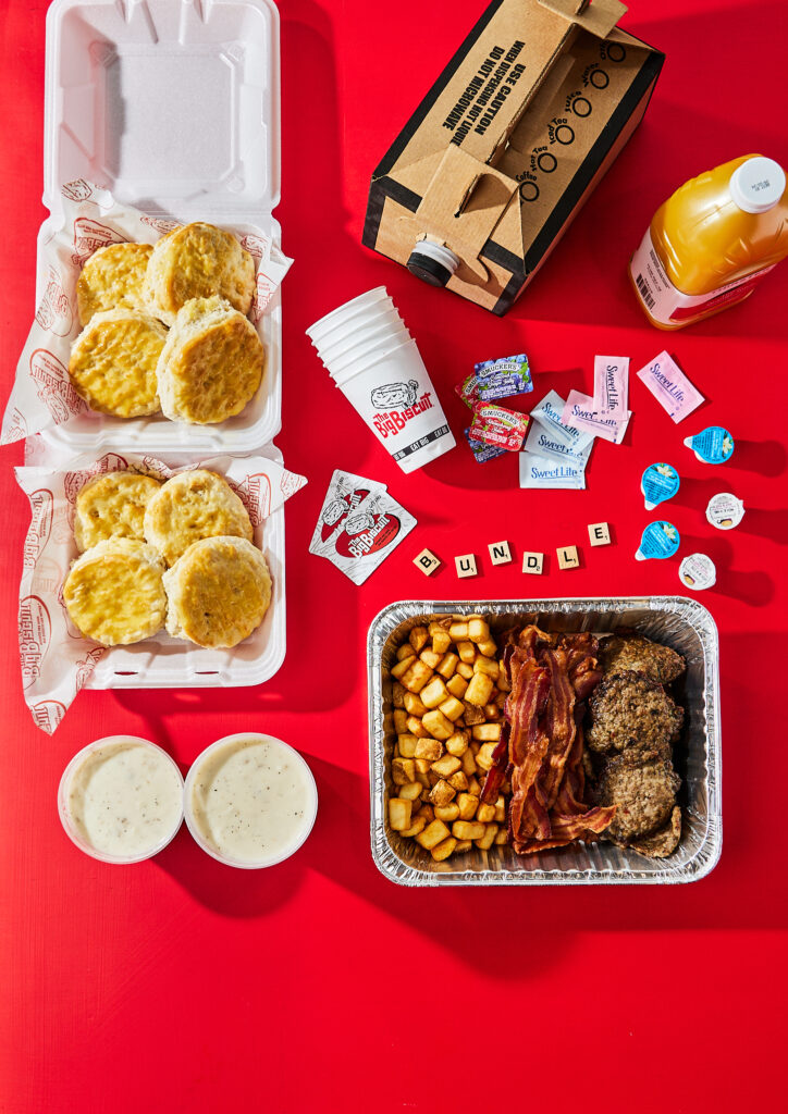Biscuit, potatoes, juice, coffee, and breakfast potaotes from The Big Biscuit